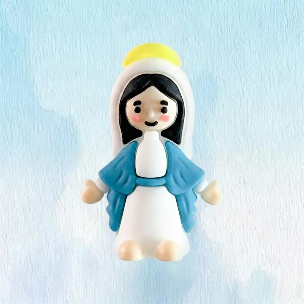 Blue-robed mini Mary figure with a golden halo